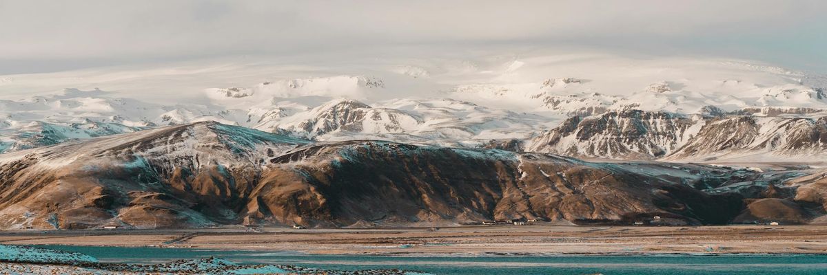 Abstract wide landscape of cold arctic mountains and sky